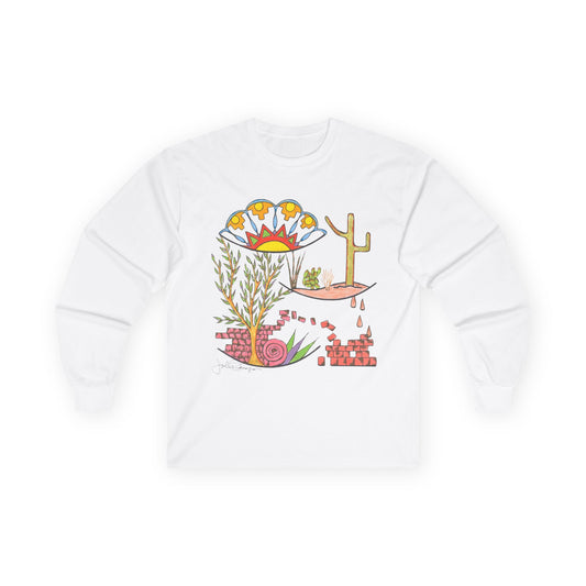 A white long-sleeve crewneck t-shirt featuring a colorful graphic print on the front with desert-themed illustrations including a cactus, flowers, and a tree.  Shirt available in different colors.