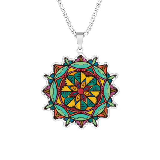A silver chain necklace with a circular mandala pendant featuring a vibrant, multicolored geometric and floral design on a plain white background.  Also available in Gold and Stainless Steel.