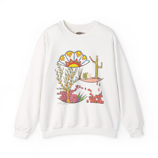 A white crewneck sweatshirt featuring a colorful graphic print on the front with a cactus, a flower, and desert-themed illustrations.  Sweatshirt comes in different colors.